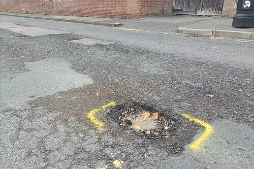 a large pothole in the road