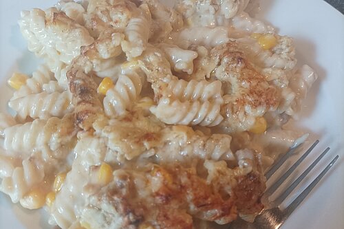 Food on plate with fork (pasta)