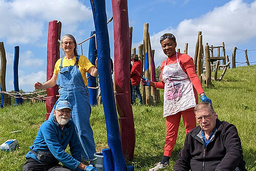Cllrs Oguntola & Trendall painting playground