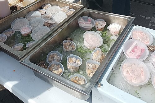 Cockles, whelks, prawns, mussels on seafood stall