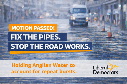 Campaign graphic reading “Motion Passed! Fix the pipes. Stop the road works.” with the line “Holding Anglian Water to account for repeat bursts,” over a blurred flooded street background.