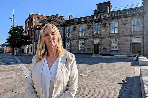 Julia Potts stood in front of fountains in Keel Square
