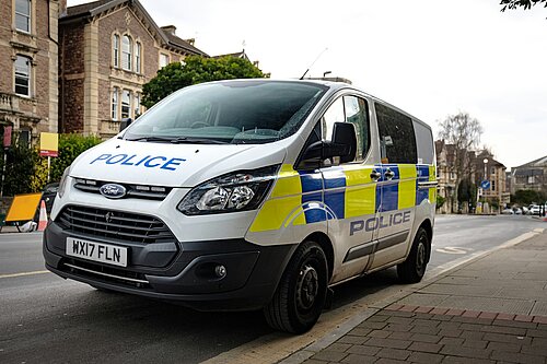 A police van parked on a street