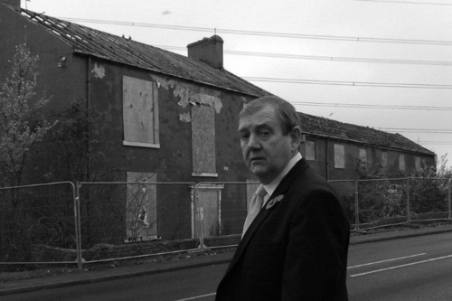 Alan Lewis outside the derelict building