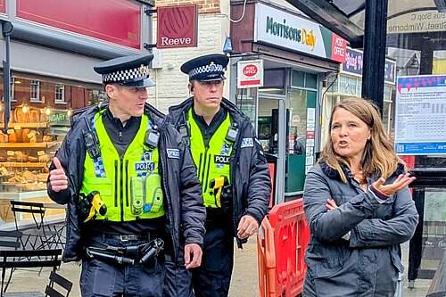 Vikki Walking round Wimborne with two police officers