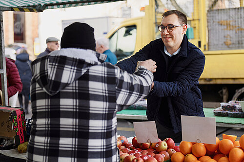 Tom Gordon MP serving at customer at Knaresborough Market