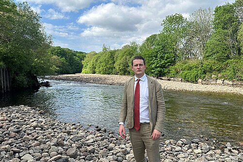 David Chadwick MP infront of River Tawe