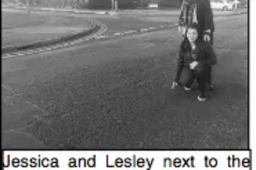Lesley and Jessica point to dangerous potholes