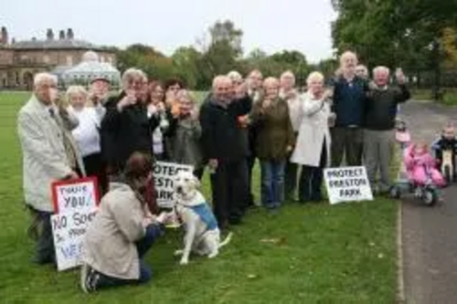 Campaigners toast the Park with Fairtrade champagne in front of Preston Hall
