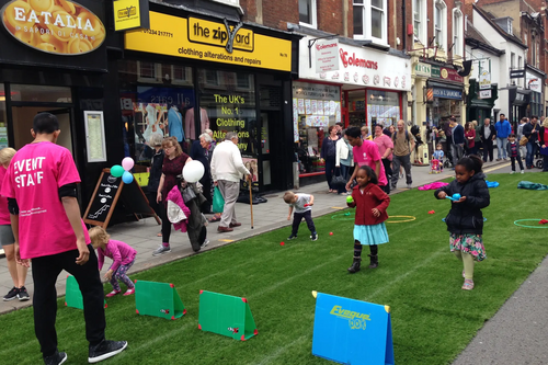 Children Enjoying the Egg and Spoon Race at Bedford's Big High Street Showcase