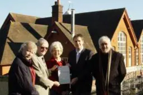 Cllr David Goodall presents the cheque to Hilldene Community Association Chairman Ken Morris