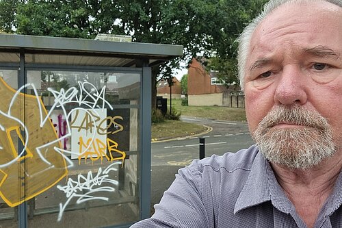 Alan Mallyon with Graffiti bus stop