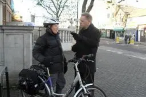 Stephen Robinson talking to a cyclist