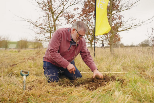 Mayor Dave Hodgson planting a tree