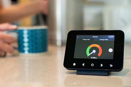 A smart meter on a kitchen worktop