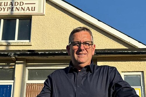 Gareth in front of the village hall