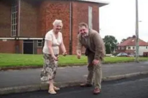 Balderstone and Kirkholt Councillors Dale Mulgrew and Pat Colclough on Queen Victoria Road