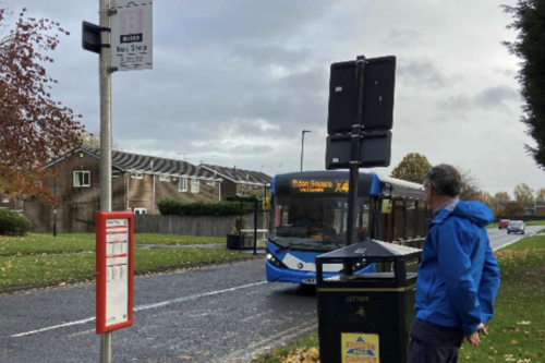 Gimme Shelter! John waiting on Windsor Way