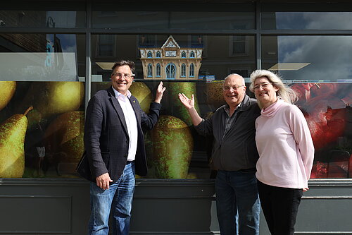 Image of people with ditto house