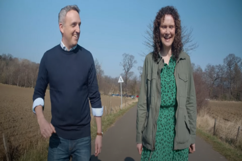 Picture of Alex Cole-Hamilton and Wendy Chamberlain walking down a road 