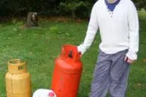 Oli Williams helps clean up the site