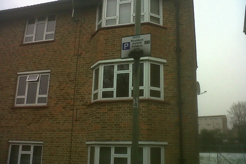 Vandalized parking signs in Cricklewood