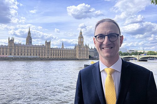 Ian Sollom MP pictured in front of the river outside of Westminster