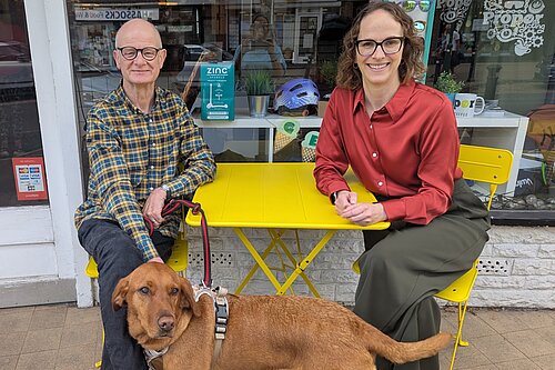 Iain and Alison sitting outside cycling shop in Hassocks