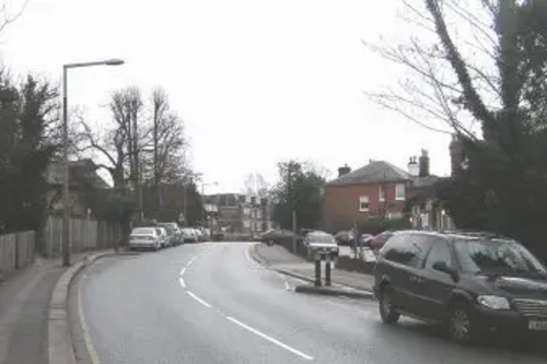Cars parked in Alexandra Road, Epsom, outside the old Cottage Hospital