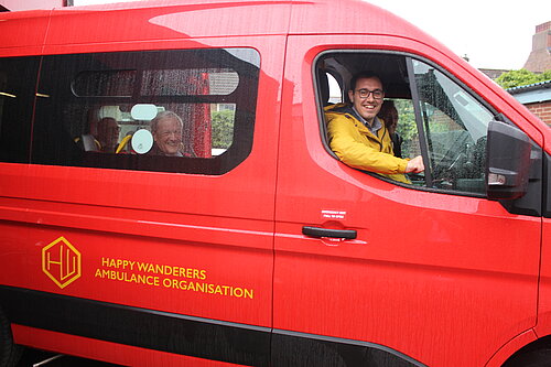Tom Gordon MP sat in the driver's seat of the Happy Wanderers mini bus