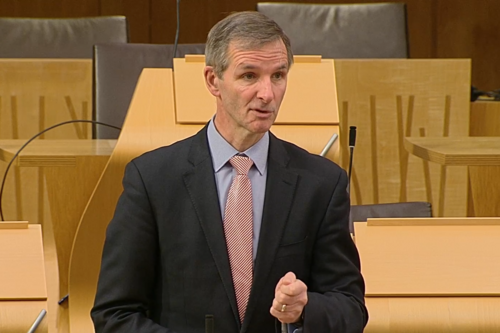 McArthur speaking in chamber