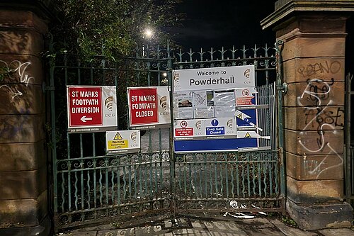 Closed gate at the path with signage