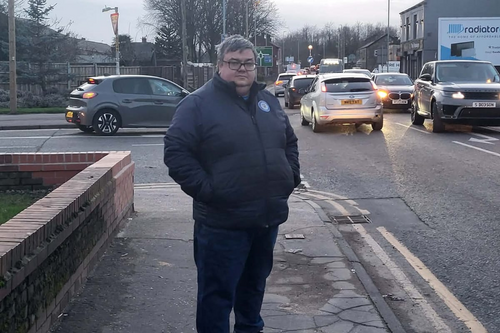 Tom Shaw with traffic behind him at Bury New Road