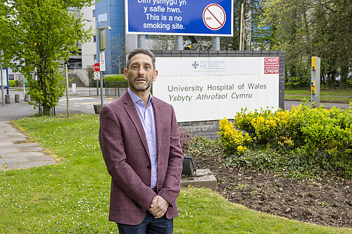 Rodney Berman in front of  University Hospital of Wales
